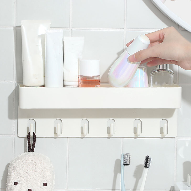 Multifunktsionaalne vannitoa hoiuriiul kleepuvate konksudega puurimise vältimiseks