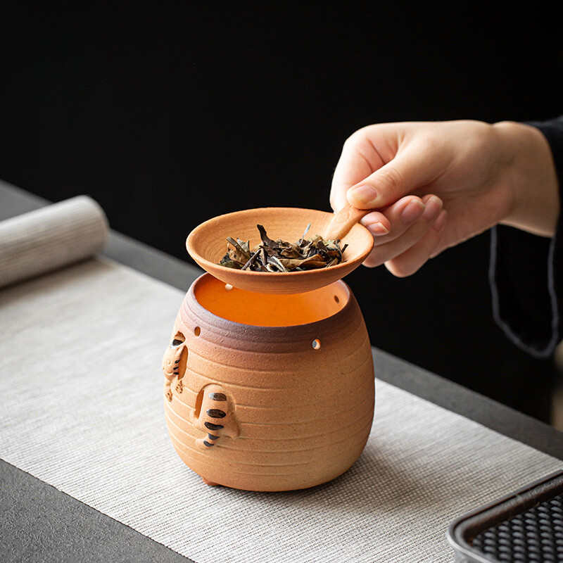 Kačiuko skrudinimas arbatos viryklė Keraminė kepimo krosnelė Maža buitinė aromato difuzorius Žvakė Akmens indai Kepti skrudinti apelsinai Samovar Baras