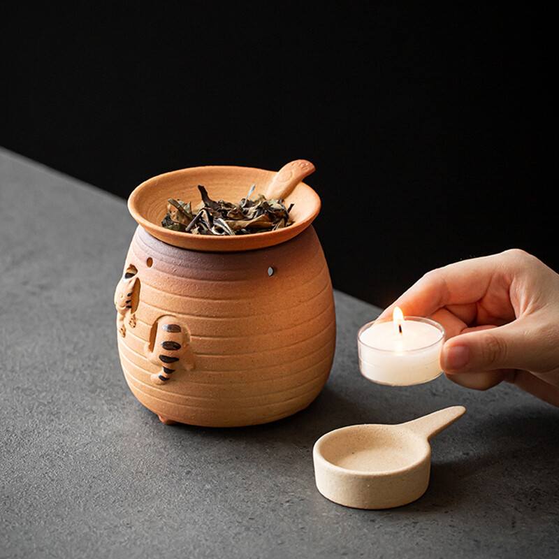 Kačiuko skrudinimas arbatos viryklė Keraminė kepimo krosnelė Maža buitinė aromato difuzorius Žvakė Akmens indai Kepti skrudinti apelsinai Samovar Baras