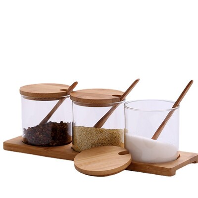3 tk klaasist maitseainepurkide komplekt puulusika ja hoiualusega, läbipaistev suhkru-soolakonteiner, maitseainete organiseerija köögitööriist
