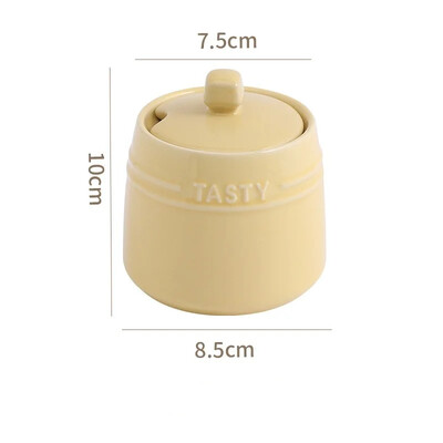 Portselanist maitseainepurgi konteiner kaanega. Lusikas keraamilised suhkrukausid maitseainekarp soolapurgid Teekorv köögilauale