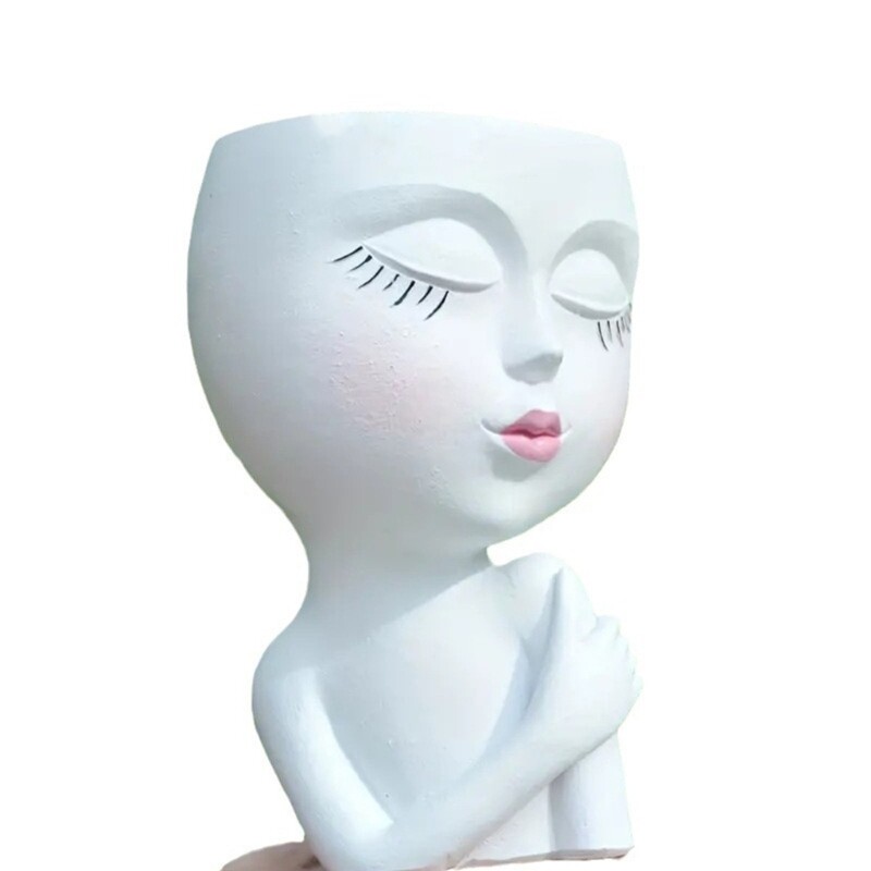 Tüdrukute skulptuuride istutusmasin potitaim kontori väikese taimeaia kaunistuseks