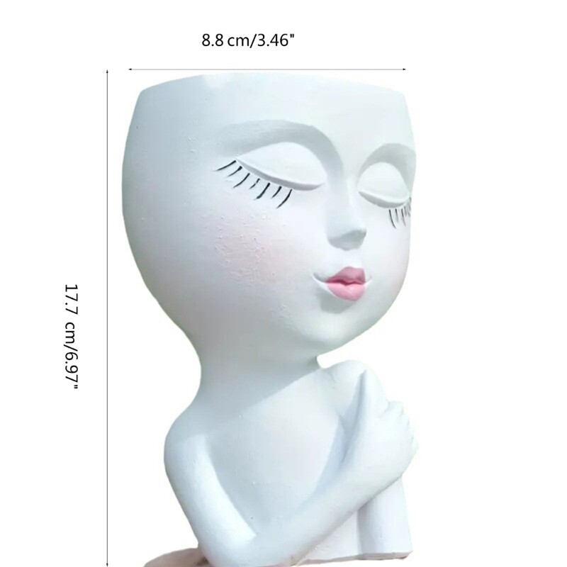 Tüdrukute skulptuuride istutusmasin potitaim kontori väikese taimeaia kaunistuseks