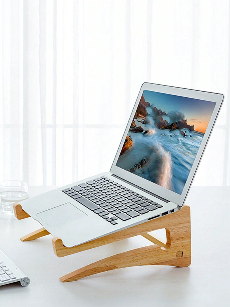 Kollane puidust sülearvuti hoiualus koos kõrgendatud vertikaalselt seisva rippuva lauaarvuti jahutusalusega
