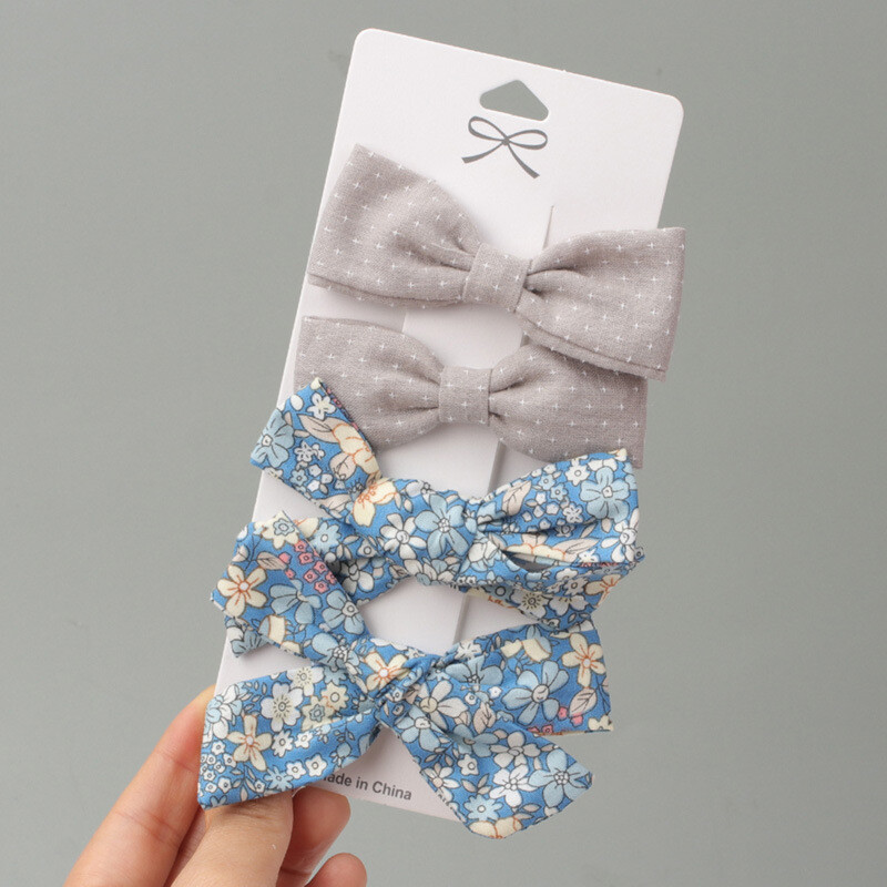 Euroopa ja Ameerika trükitud populaarne lastekangas lillelise kaarjuuksenõelaga, armsad väikese tüdruku küljeklambrid neli ühes kaardis