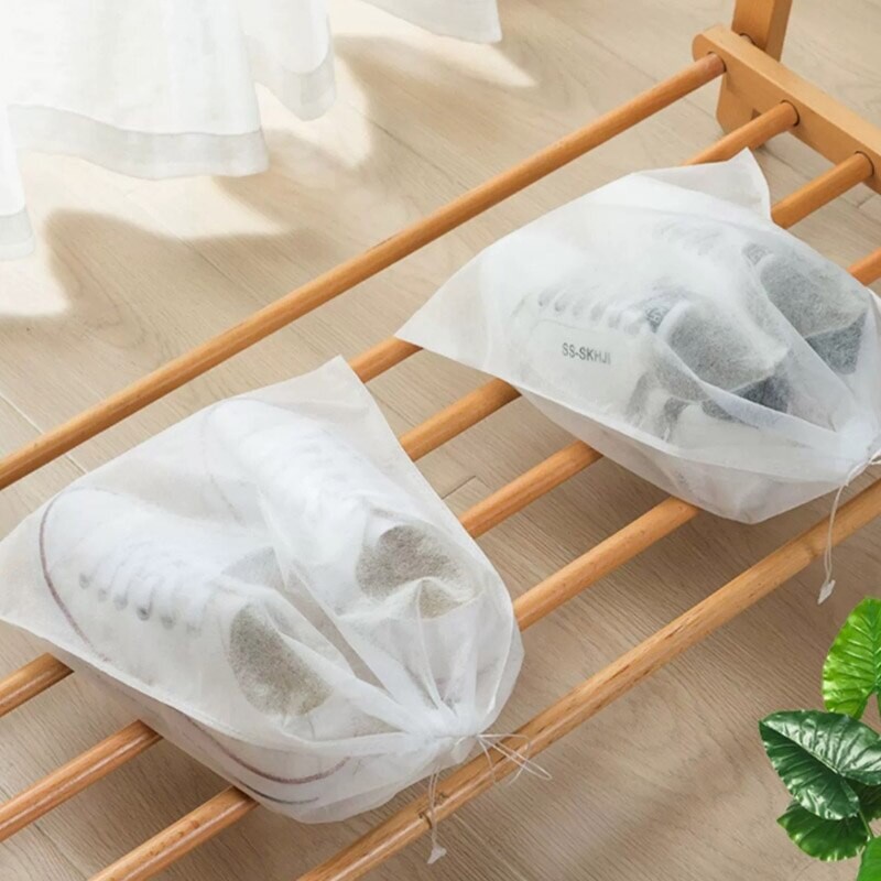 10 tk lausriidest kingakott, nööriga hoiukott Väikesed valged kingad tolmukindel ja kollane õhukuivatuskott reisijalatsi kate