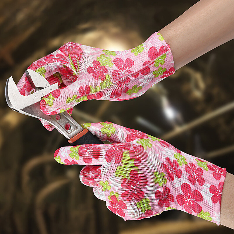1paar naiste aiakindaid, trükitud roosa polüesterroosa lateks, töötamiseks mõeldud libisemiskindlad kaitsekindad mehaanika ehitustööriistadele