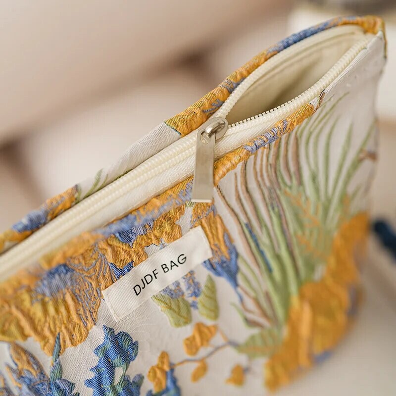 Naiste meigikott, värviline lilleline lõuend, suure mahutavusega huulepulk õhkpadjaga hoiukott.