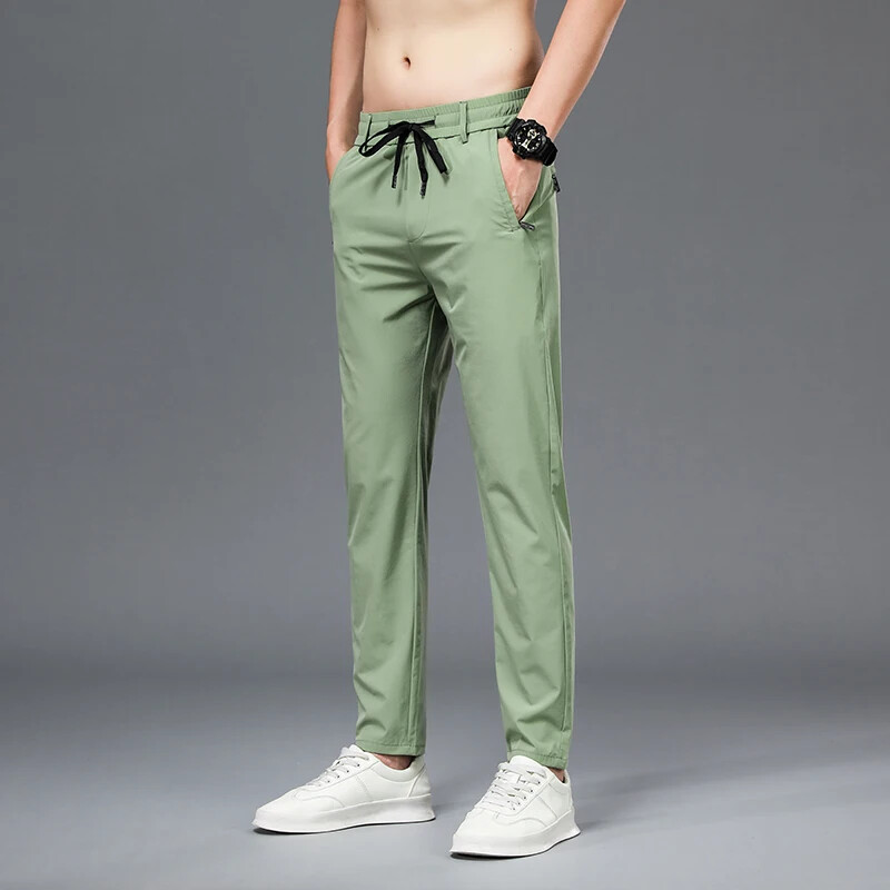 Kevadsuvi tikandid Meeste õhukesed sirged õhukesed püksid elastne vöökoht Mood vabaaja laia säärega püksid Meeste jooksupüksid