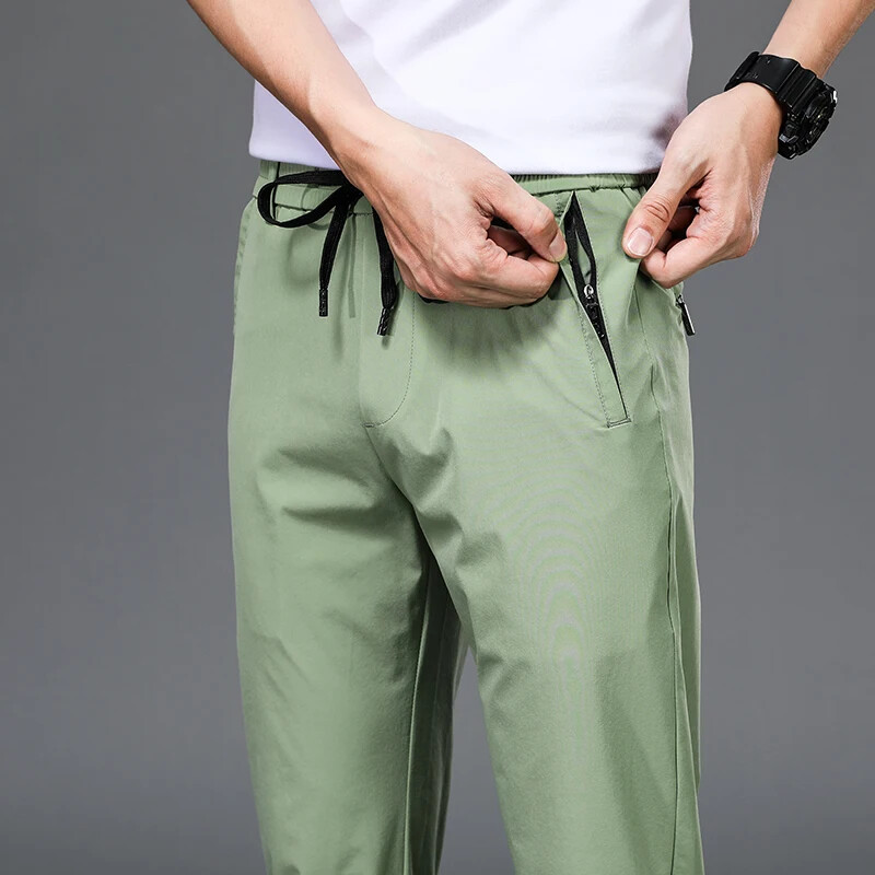 Kevadsuvi tikandid Meeste õhukesed sirged õhukesed püksid elastne vöökoht Mood vabaaja laia säärega püksid Meeste jooksupüksid