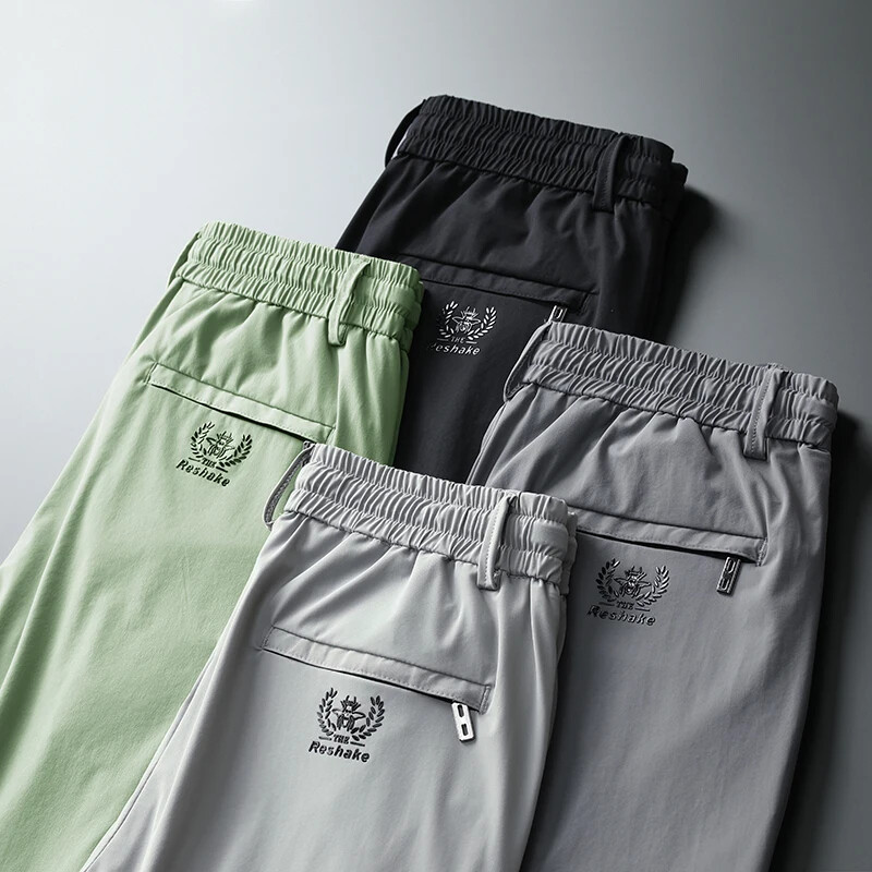 Kevadsuvi tikandid Meeste õhukesed sirged õhukesed püksid elastne vöökoht Mood vabaaja laia säärega püksid Meeste jooksupüksid