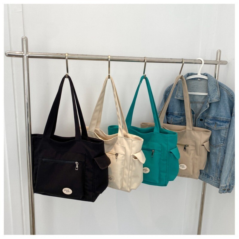 Geantă de umăr de modă pentru femei, geantă de tote pentru studenți de capacitate mare, 2023, geantă nouă de pânză pentru navetiști.