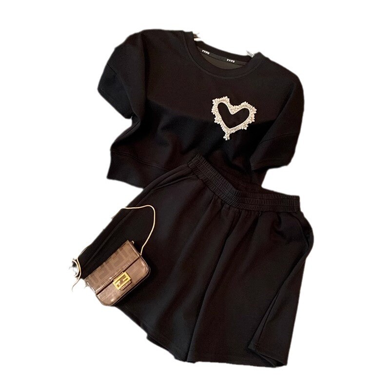 Naiste vabaaja spordiülikond, suvine vabaaja kaheosaline komplekt, moekas vanust vähendav lühikeste varrukatega lühikesed püksid, kaheosaline komplekt naistele