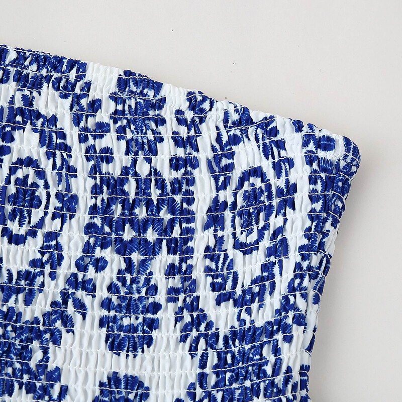 Trükitud lillelised kärbitud ülaosaga, rihveldatud rinnakorviga, õlakateta, volangiga põhjaga naiste suverõivad