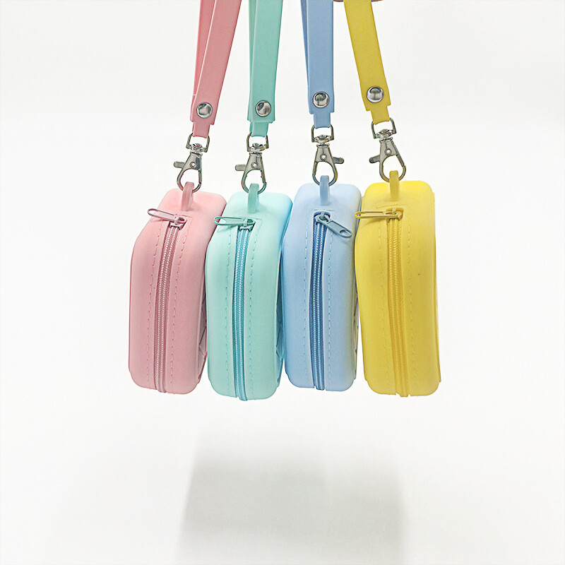 Kommivärvi silikoonist ruudukujuline mündikott kõrvaklappide hoiukott Naiste kaasaskantav huulepulk kosmeetikakott Üliõpilaste lihtne väike esemekott