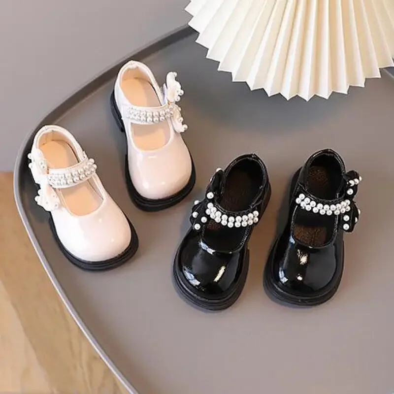 Tüdrukute uus lakk, pehme tald pärl vibu madala suu printsess ühe kingaga laste vaba aja spordi libisemisvastane väike nahk