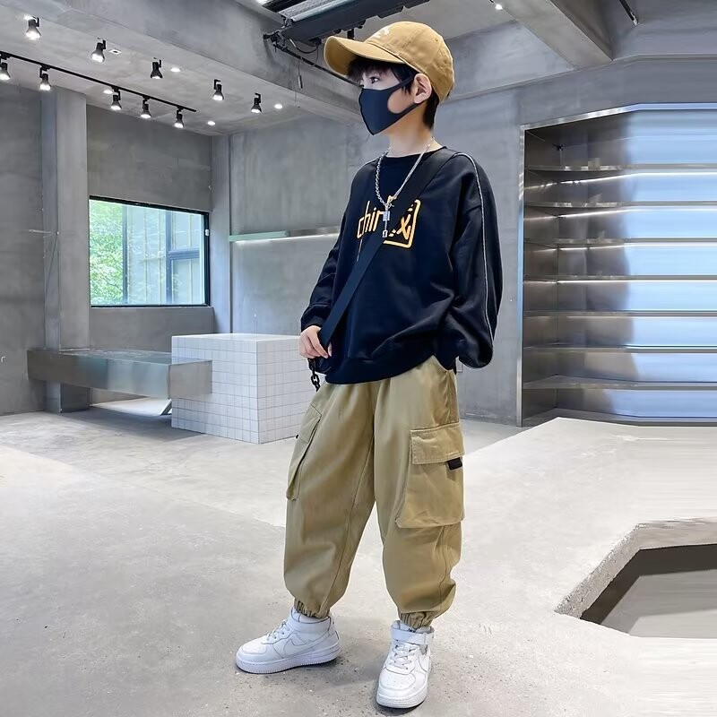 Poiste püksid kevadised ja sügisesed uued pehmed laste tööpüksid kevadised ja sügisesed keskmise suurusega laste lahedad vabaaja püksid