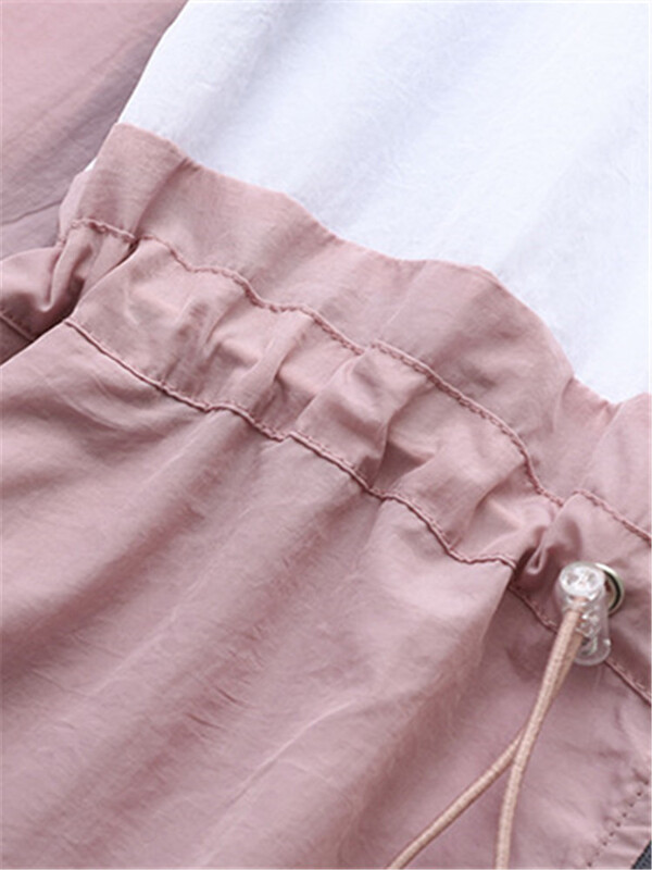 Suures suuruses naisterõivad suvine õhuke vabaaja jope, kontrastvärvi, blokeeritud kapuutsiga lukuga jakk ja vöökohal on pingutusnöör