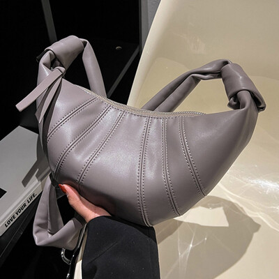 Mekana kožna polumjesečeva torba za knedle vrhunske kvalitete za žene 2024. Nova modna luksuzna dizajnerska ručna torba Ženska skitnica torba na rame