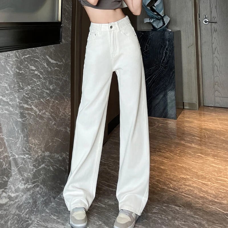 Naine kõrge vöökohaga vanaaegse disaineriga virnastatud teksad Naiste suured laiad püksid, tüdrukud, mood valged helesinised teksapüksid