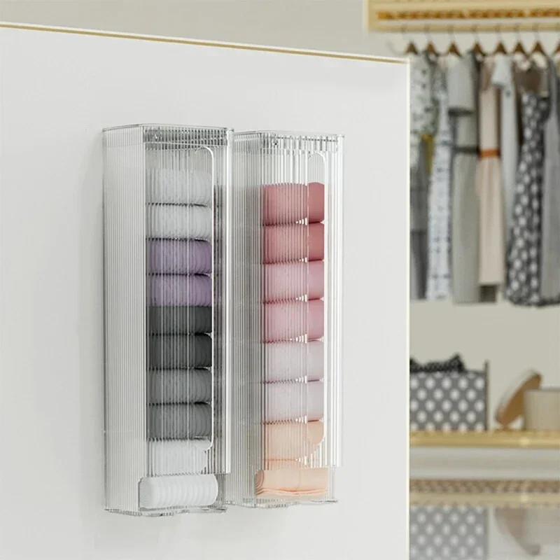 Uzglabāšanas organizatora kaste apakšbiksēm un zeķēm, pie sienas piekarams uzglabāšanas turētājs, virtuves atkritumu plastmasas maisiņu dozators, mājas