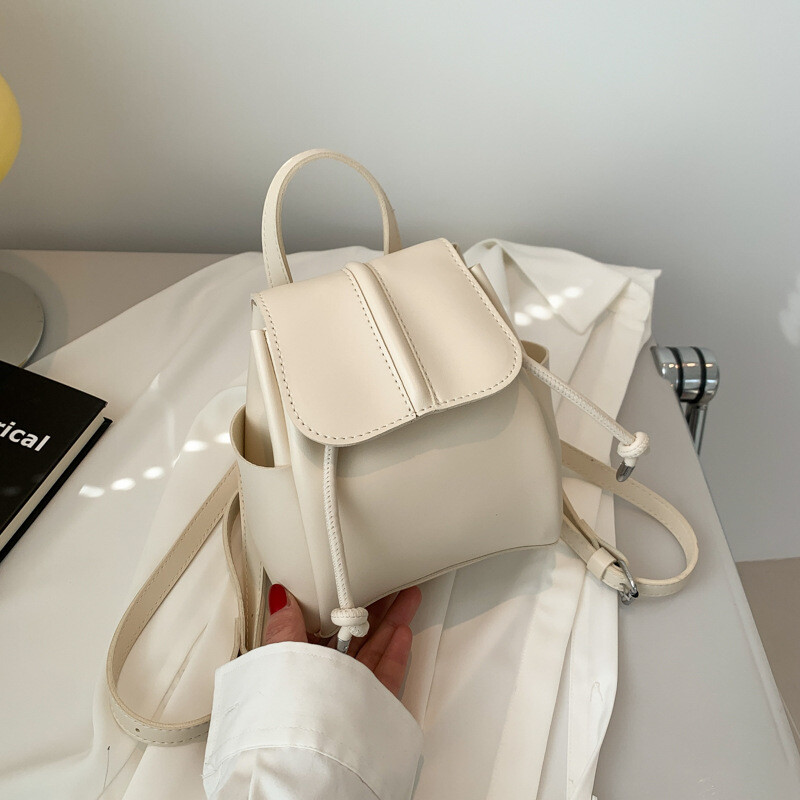 Mekani PU ruksak na dva ramena, ženski korejski modni, ležerni jednobojni, jednostavni mini ruksak, kopča s uzicom, slatki ruksak