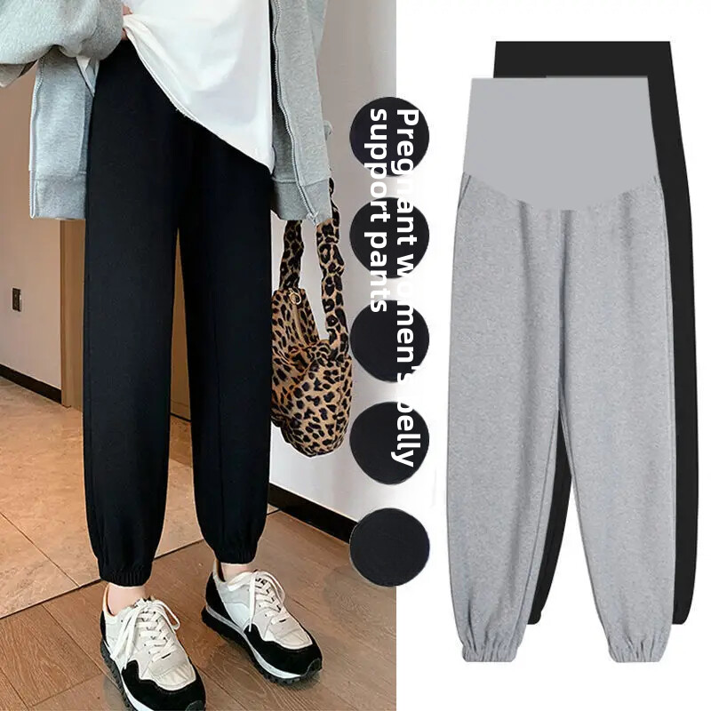 Grūtnieču bikses 2023. gada pavasaris. Modes virsdrēbes, brīvas jostasvietas bikses, ikdienas sporta apavi grūtniecēm