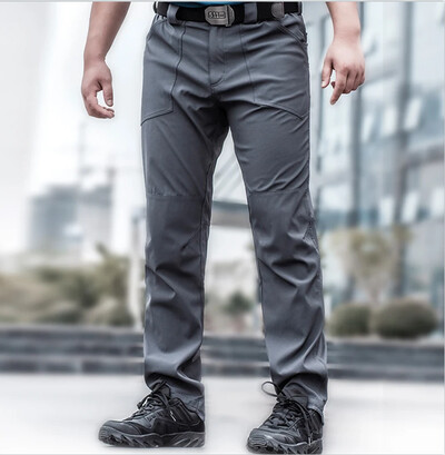 Āra plānās taktiskās bikses elastīgas ātri žūstošas treniņbikses brīvas alpīnisma bikses ar vairākām kabatām treniņa apģērbs