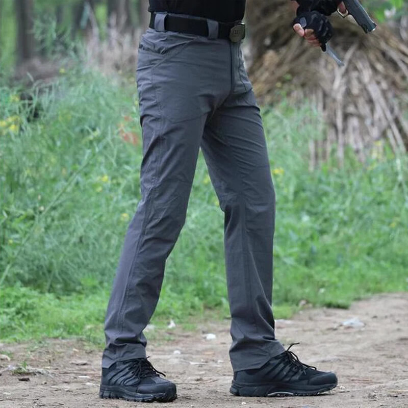Āra plānās taktiskās bikses elastīgas ātri žūstošas treniņbikses brīvas alpīnisma bikses ar vairākām kabatām treniņa apģērbs