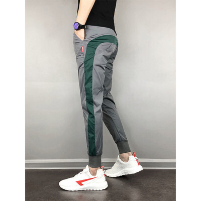 Vīriešu sporta bikses 2020. gads. Populāras ikdienas sporta bikses Vīriešu skriešanas bikses Modes ielas apģērbs Vīriešu formāls ikdienas apģērbs