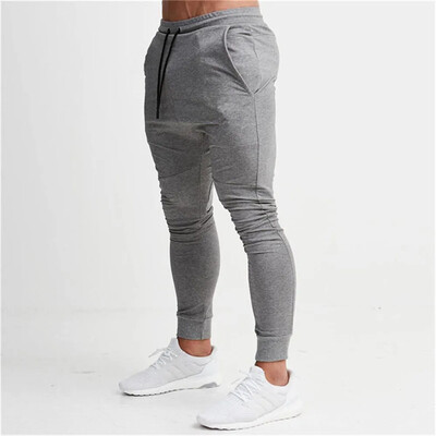 2024 Fashion Meeste Jõusaalid Puhtavärvilised püksid Joggers Fitness Vabaaja pikad püksid Meeste Treening Kitsad dressipüksid Jogger dressipüksid