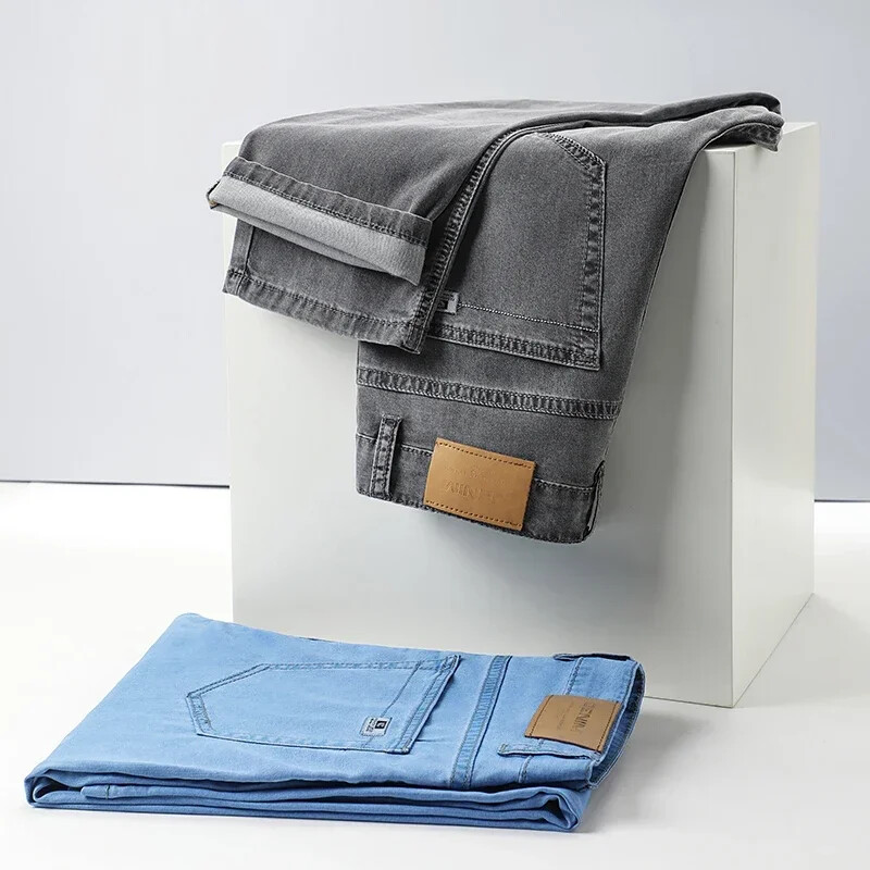 Καλοκαιρινό νέο ανδρικό λεπτό ανοιχτό μπλε ίσιο τζιν Επιχειρηματικό ύφασμα Lyocell Stretch Πολυτελές τζιν παντελόνι Αντρικό παντελόνι μάρκας