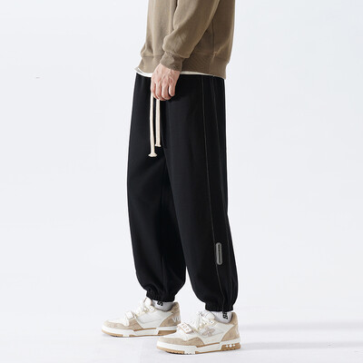 Korejske modne trenirke za trčanje Muške nove jesenske svijetlosive vrećaste hlače širokih nogavica Ulična odjeća Muške ležerne hlače s kravatom Muške