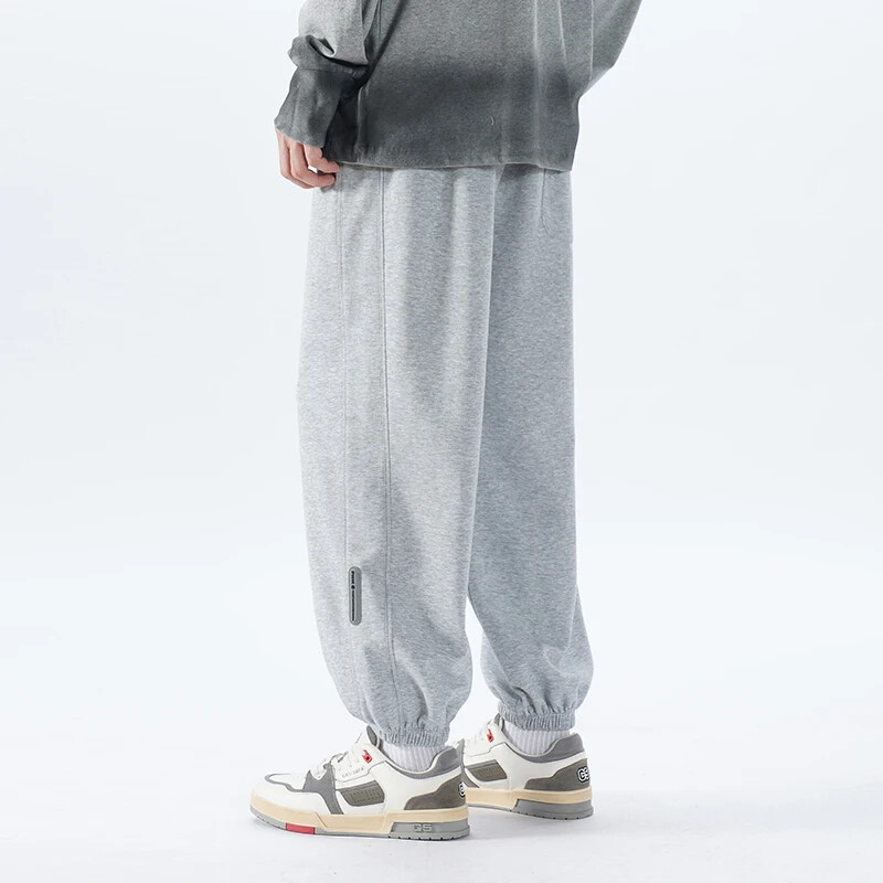 Korejske modne trenirke za trčanje Muške nove jesenske svijetlosive vrećaste hlače širokih nogavica Ulična odjeća Muške ležerne hlače s kravatom Muške