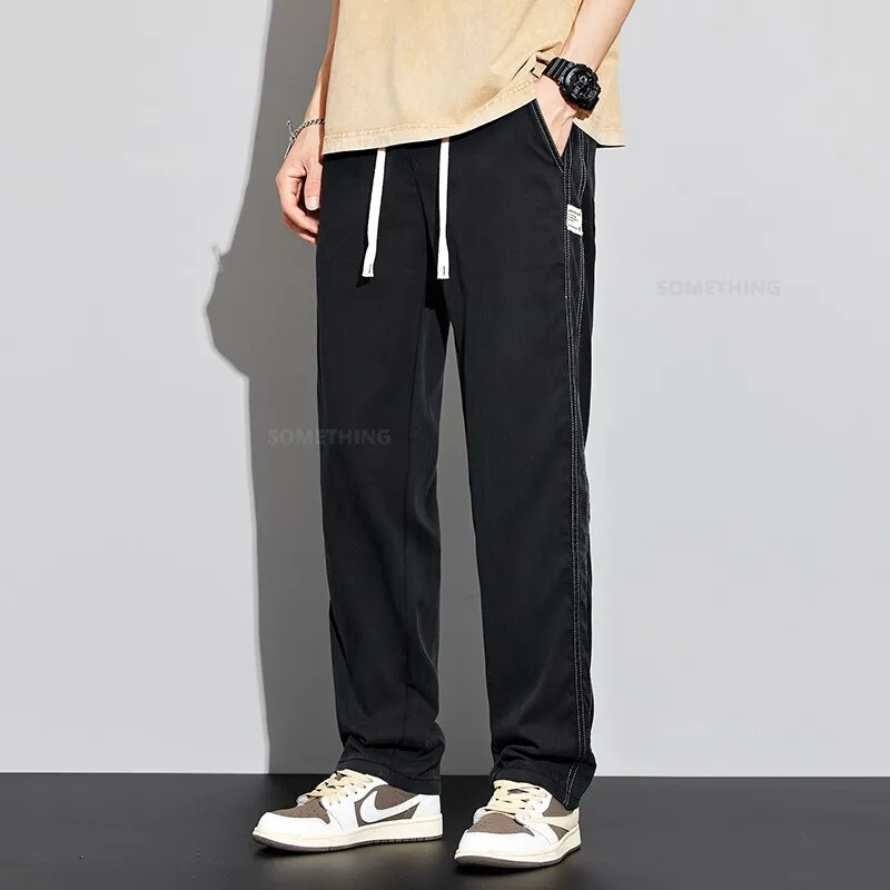 2024. gada jaunas vīriešu mīkstas liocela bikses elastīgas jostasvietas savelkamās bikses platas, taisnas, vīriešu ledus zīda ikdienas bikses, liela izmēra 4XL