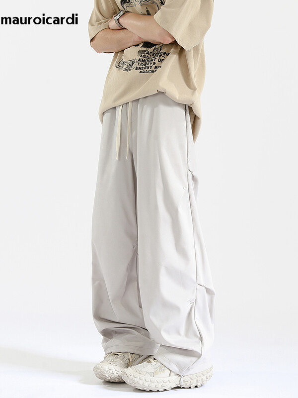 Mauroicardi tavaszi őszi hosszú, laza, alkalmi táskás, folyékony puha fekete széles szárú férfi nadrág húzózsinórral, magas derekú ruházat 2024