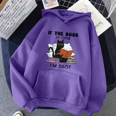 Ja grāmata ir atvērta, es esmu aizņemts, melnā kaķa džemperis.