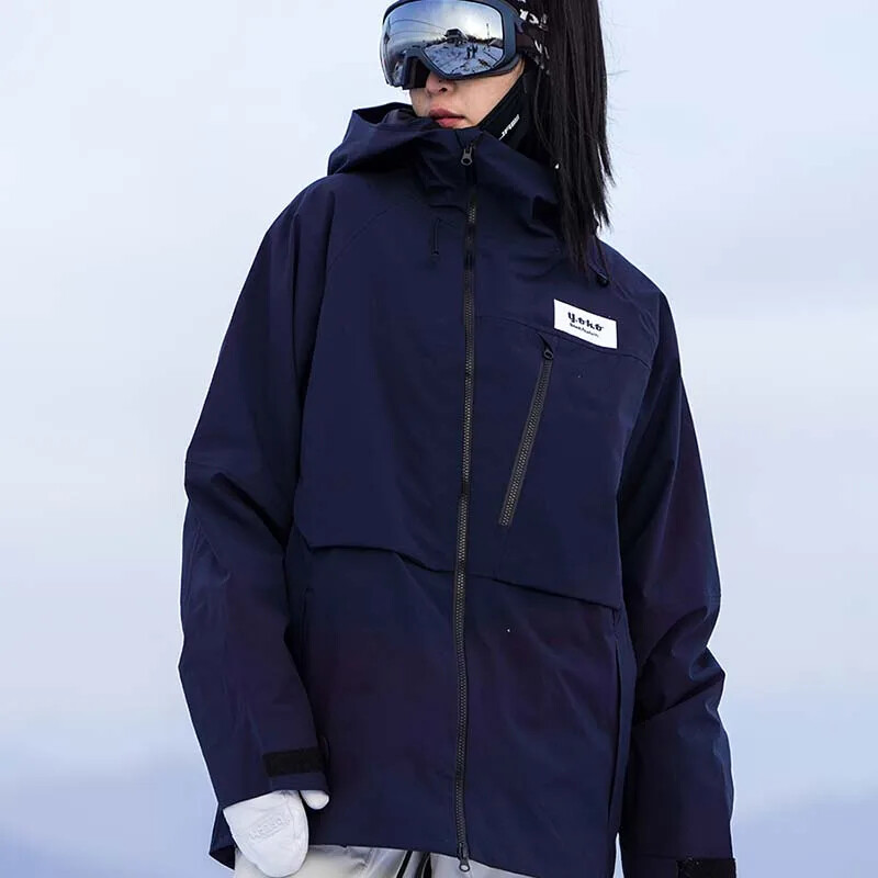 2025. gada jauna ziemas cietā slēpošanas jaka āra slēpošanai sievietēm vīriešiem, vēja necaurlaidīga, ūdensnecaurlaidīga, elpojoša pieaugušo slēpošanas jaka Sniega mēteļi ar kapuci