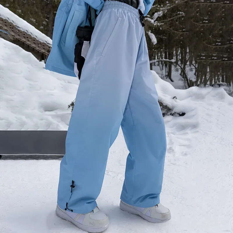 Új téli snowboardos sínadrág 2025 sínadrág szélálló vízálló meleg tartós kültéri bő hónadrág férfi női