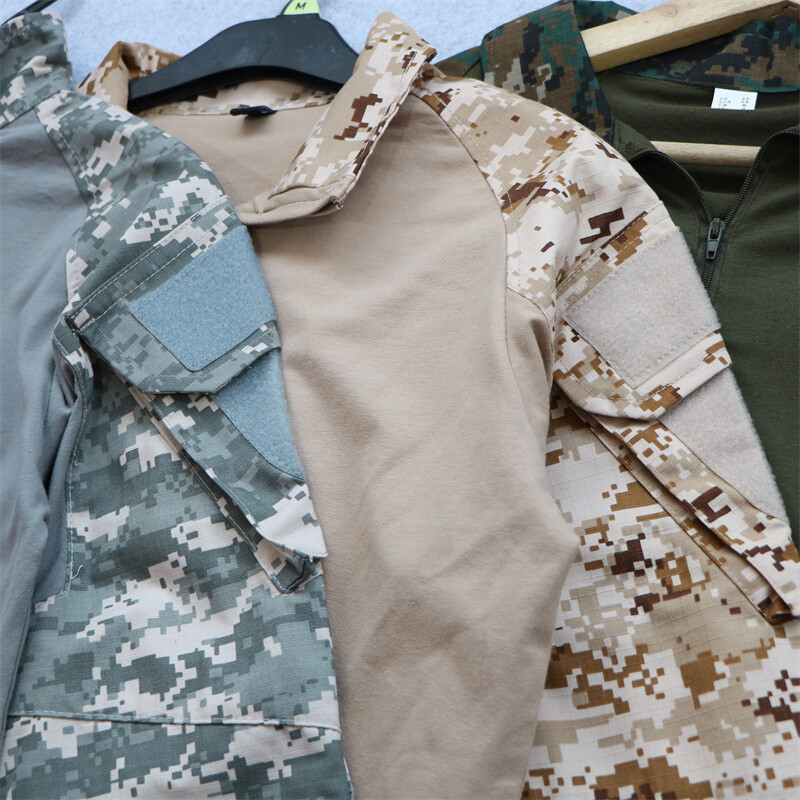 Vanjska kamuflažna majica dugih rukava s više džepova, samostojeći ovratnik, rastezljivo odijelo u obliku žabe