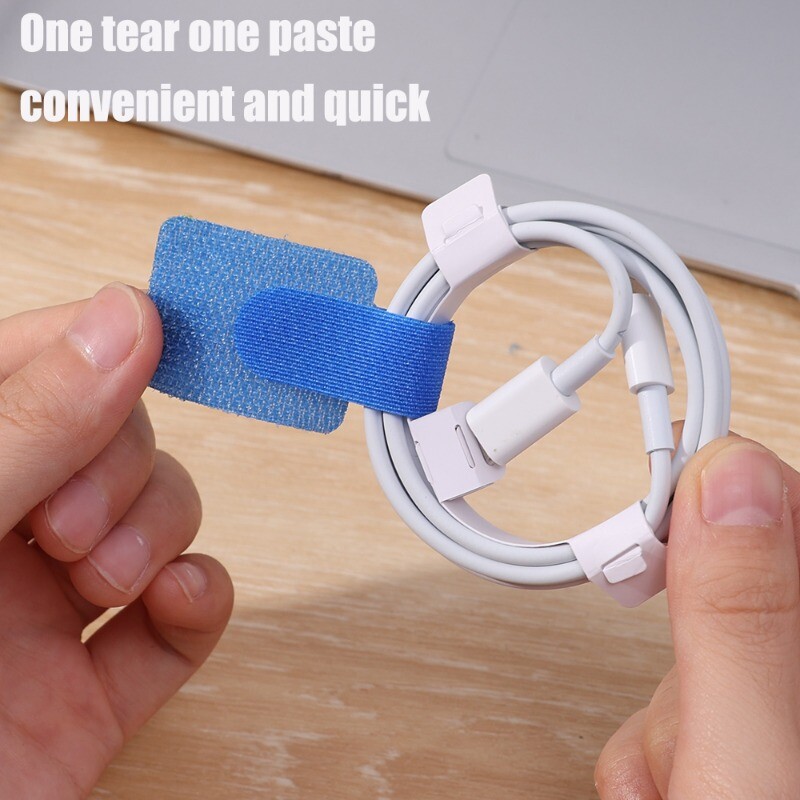 Освобождаващи се кабелни връзки Самозалепваща лента Органайзер за кабели за многократна употреба Магически стикер Каишка Фиксирано довършително съхранение за телефонни слушалки