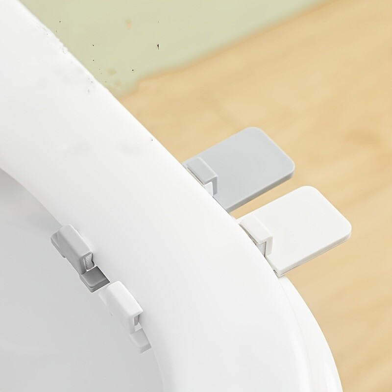 1PC plastmasas izvelkamais tualetes vāka pacēlājs, roktura pleznas, tualetes karikatūra tualetes sēdeklis, roktura attaisāmais, tualetes vāka attaisāmais