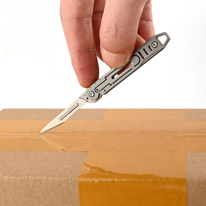 Rozsdamentes acél segédkés, gyorsan nyitható, hordozható éles gyümölcsös összecsukható kés mini kulcstartó medál szétszedő gyorsszerszám