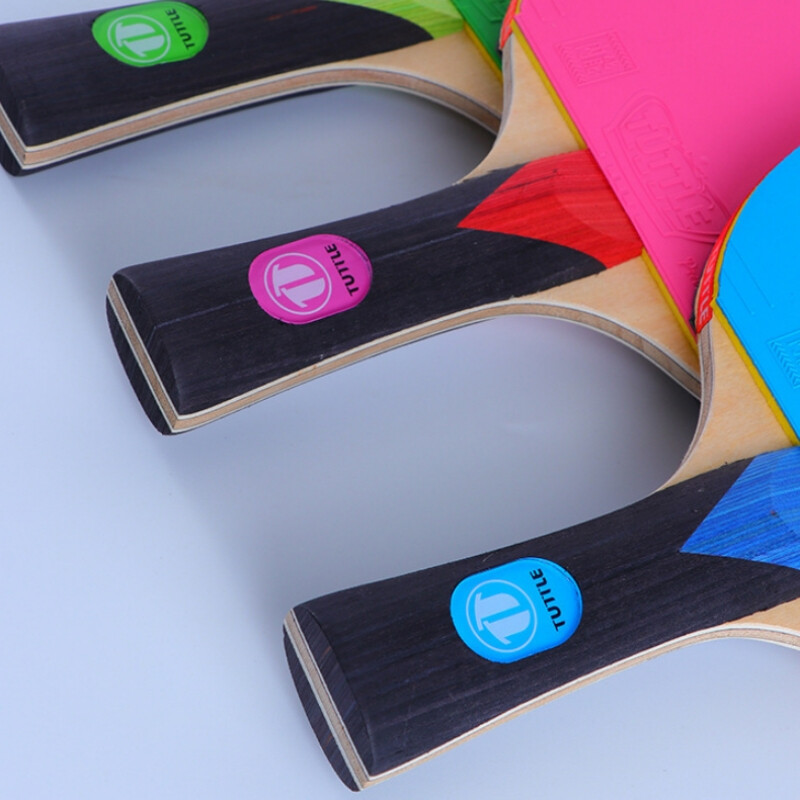 Tuttle spalvota stalo teniso raketė 5 fanera + 2 anglies pluošto stalo teniso irklentė su juodais + mėlynais / žaliais / rožiniais spalvingais gumos paklodėmis