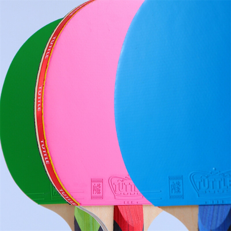 Tuttle spalvota stalo teniso raketė 5 fanera + 2 anglies pluošto stalo teniso irklentė su juodais + mėlynais / žaliais / rožiniais spalvingais gumos paklodėmis