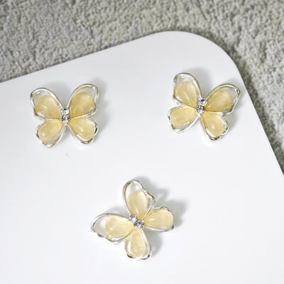 10 komada Pola mačje oko leptir Nail Art šarm 3D legure sjajni prozirni leptir ukrasi za nokte DIY luksuzni dodaci za nokte