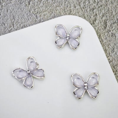 10 komada Pola mačje oko leptir Nail Art šarm 3D legure sjajni prozirni leptir ukrasi za nokte DIY luksuzni dodaci za nokte