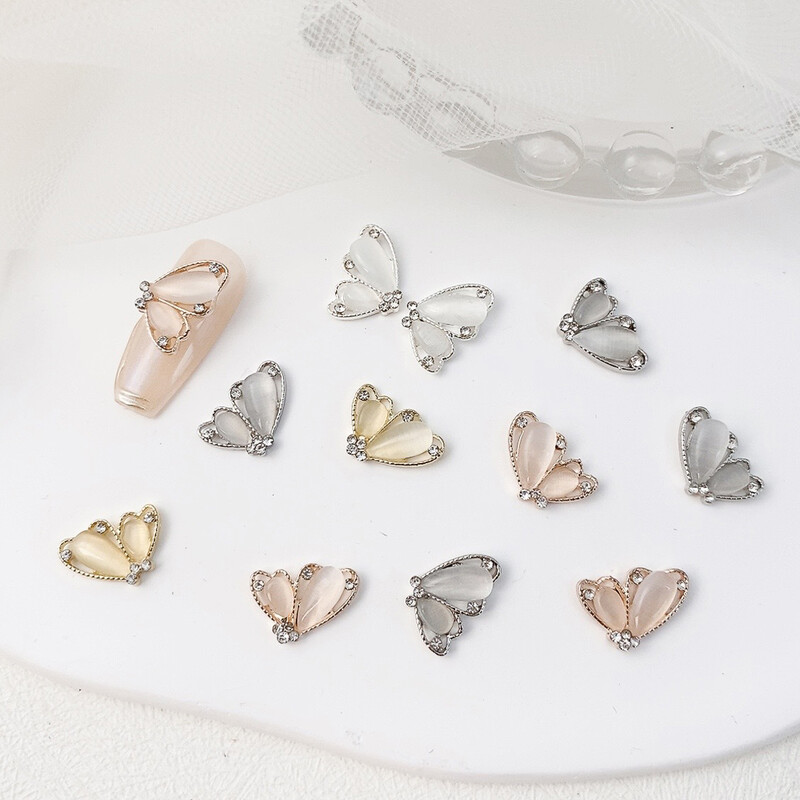 10 komada Pola mačje oko leptir Nail Art šarm 3D legure sjajni prozirni leptir ukrasi za nokte DIY luksuzni dodaci za nokte