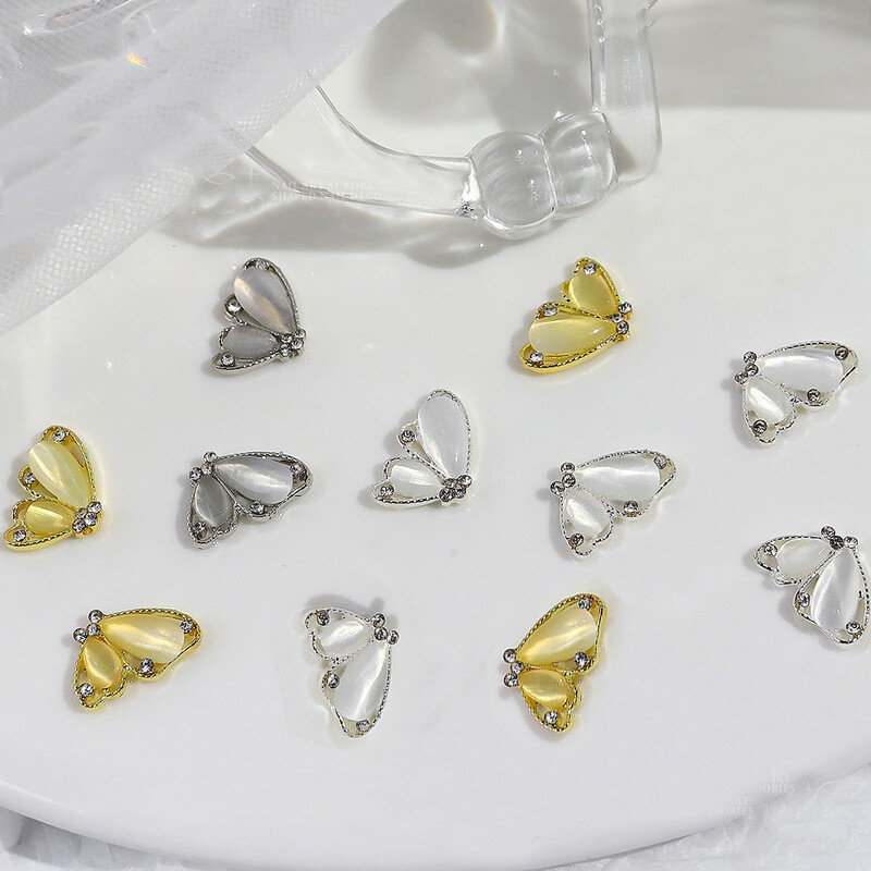 10 komada Pola mačje oko leptir Nail Art šarm 3D legure sjajni prozirni leptir ukrasi za nokte DIY luksuzni dodaci za nokte