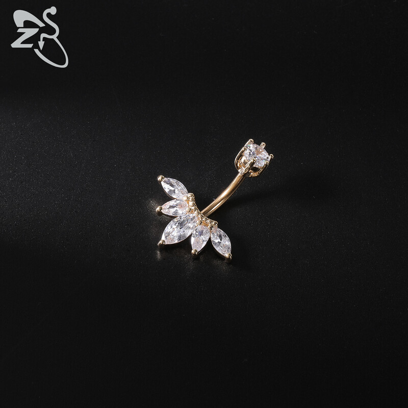 Piercing do pupka z nehrdzavejúcej ocele 14G zlatej farby s hadím srdcom a lesklým CZ krištáľom v tvare motýľa.